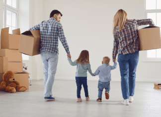 family with moving boxes. Tips for moving. Des Moines Mom