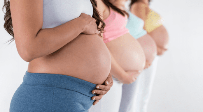women holding pregnant belly