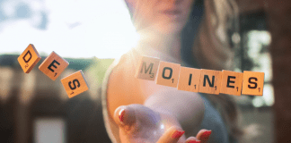 woman throwing scrabble tiles. Des Moines Mom