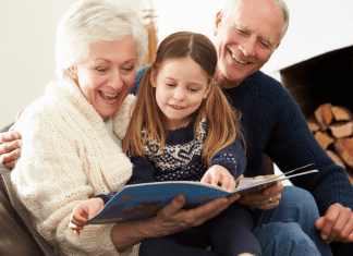 grandparents and girl reading. Des Moines Mom